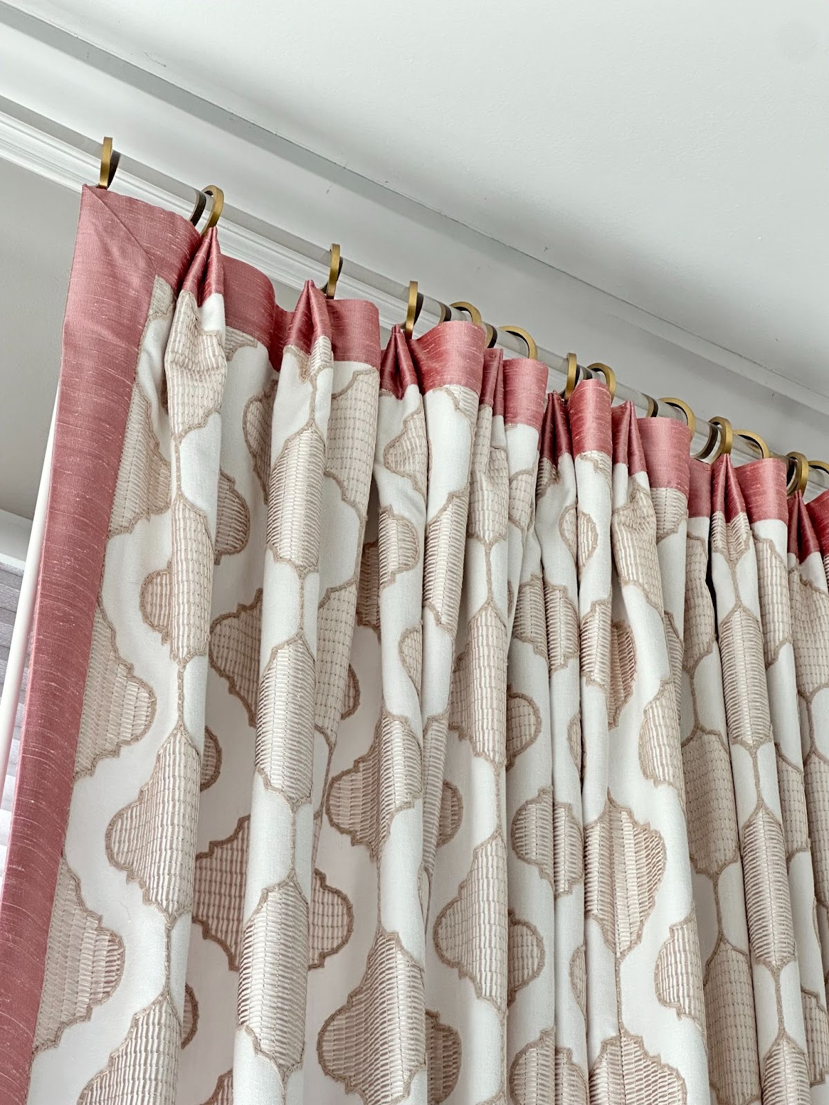 custom pink and tan patterned drapes on a window in a Chattanooga home.